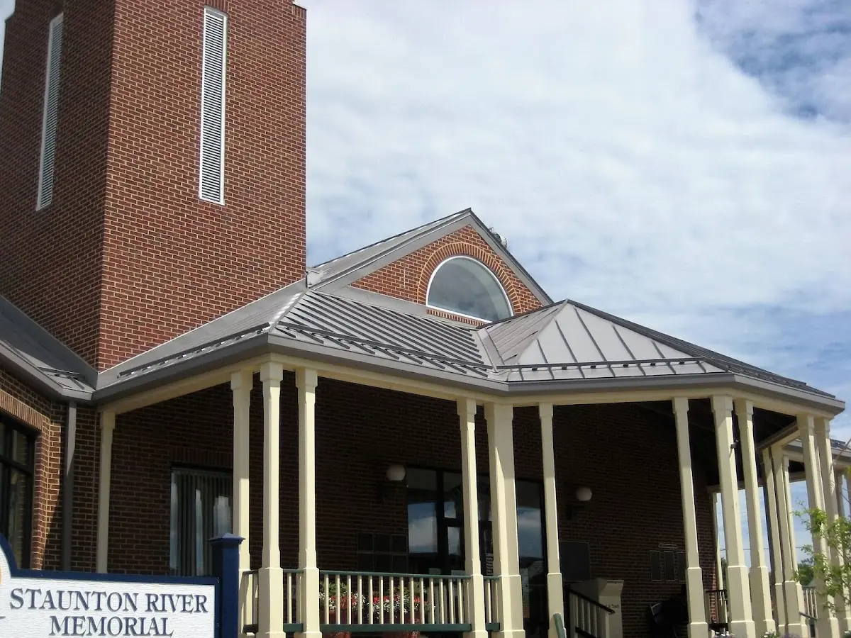 Skilled roofing craftsmen working on a residential roof in Warrensburg